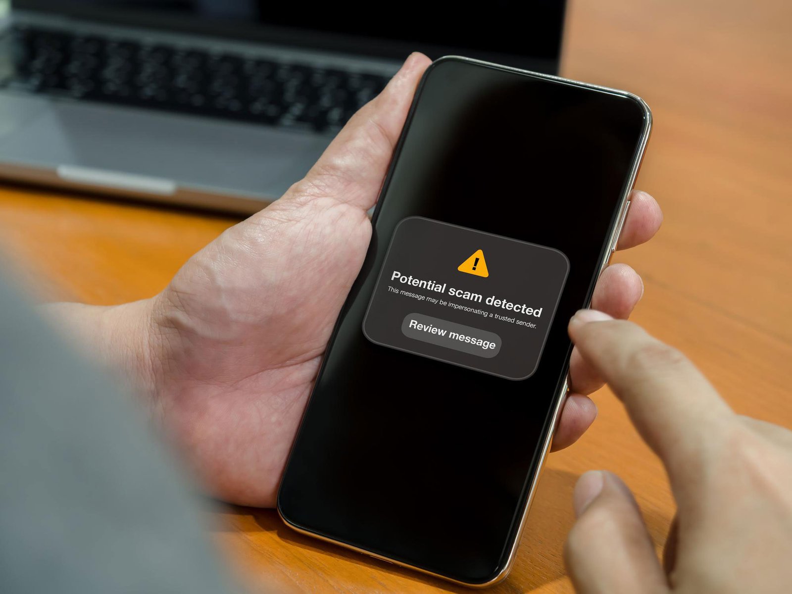 Smartphone displaying a suspicious message while illustrating WhatsApp scam prevention in Pakistan.